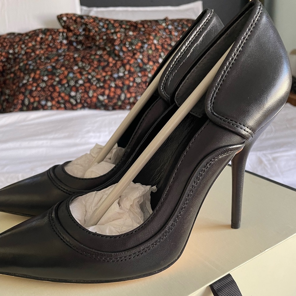 Black leather pumps